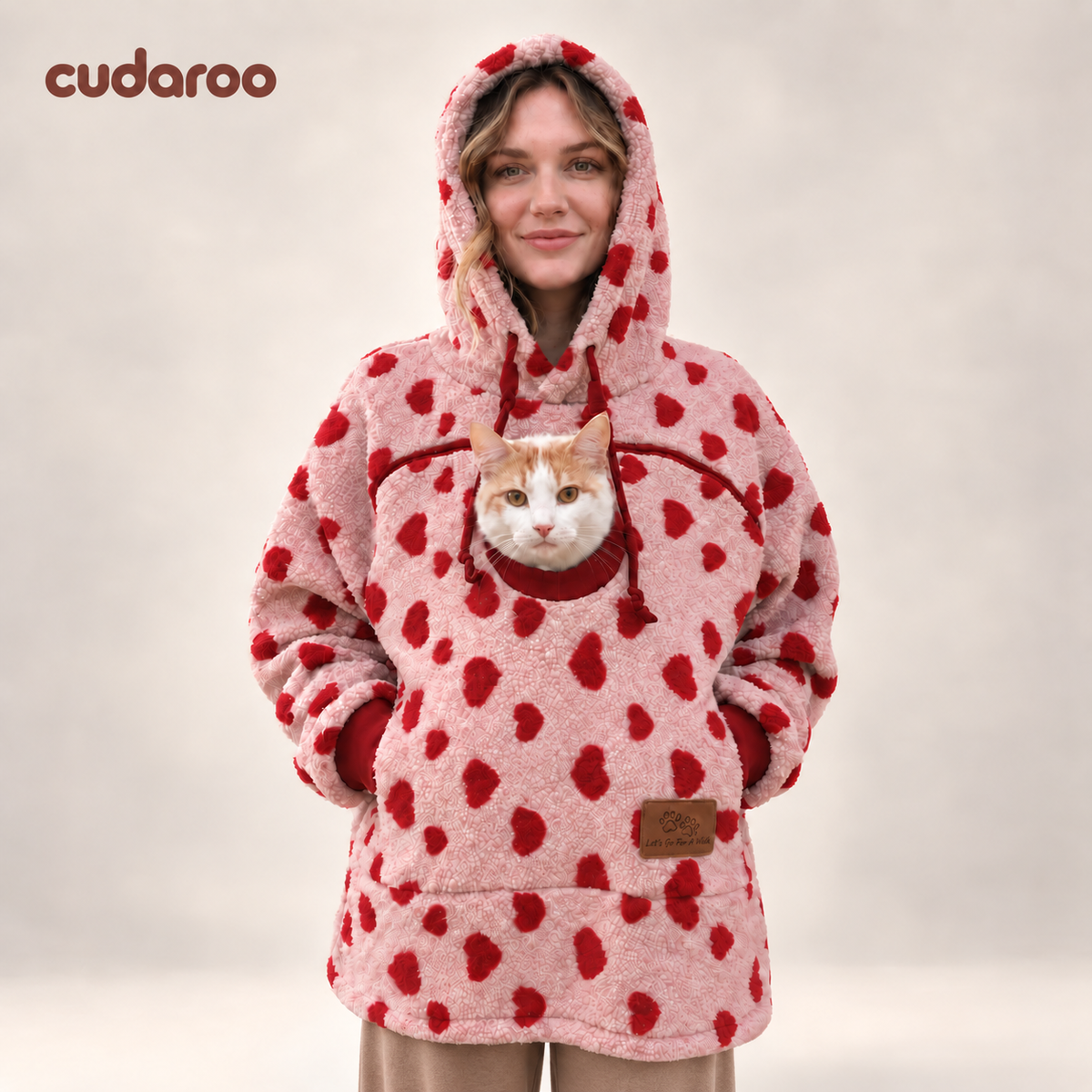 Cudaroo pet pouch hoodie in red heart print with a cat in the chest pouch