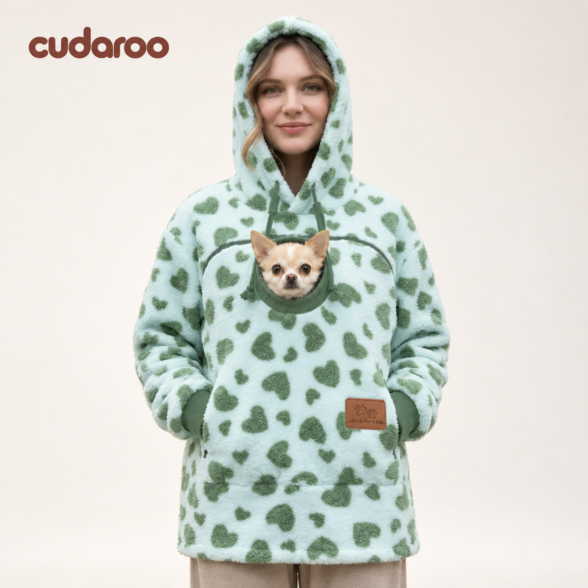 Cudaroo pet pouch hoodie in green heart print with a small chihuahua in the chest pouch